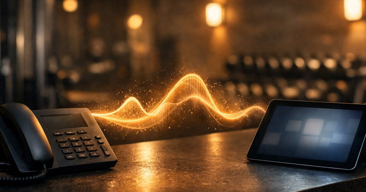 AI receptionist handling gym membership calls: desk phone connected to tablet with booking data via energy wave in gym environment